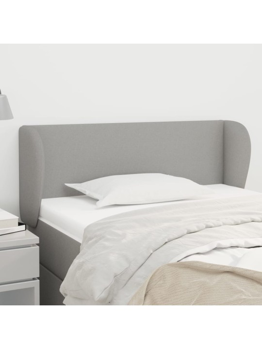 Čelo postele typu ušák světle šedé 83x23x78/88 cm textil