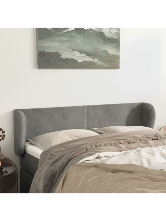 Čelo postele typu ušák světle šedé 147x23x78/88 cm samet