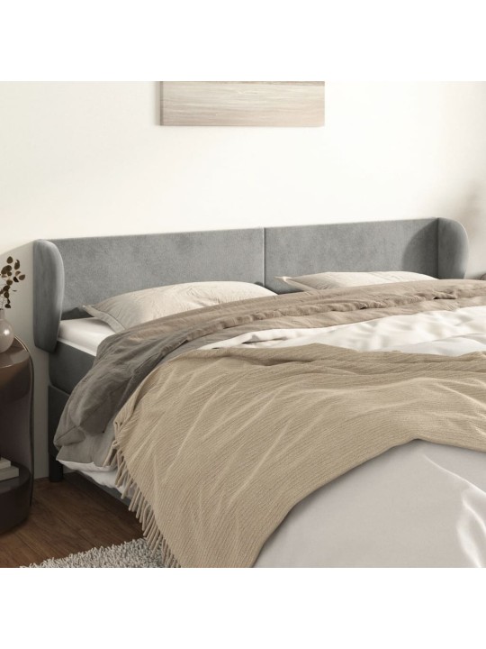 Čelo postele typu ušák světle šedé 163x23x78/88 cm samet