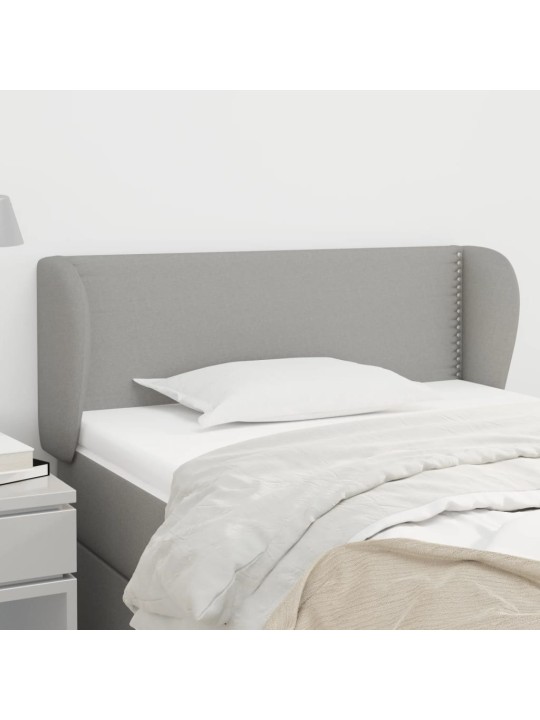 Čelo postele typu ušák světle šedé 83x23x78/88 cm textil