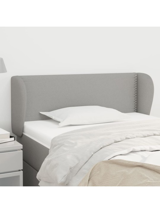 Čelo postele typu ušák světle šedé 103x23x78/88 cm textil