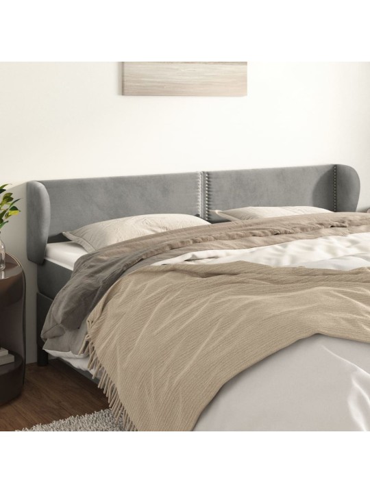 Čelo postele typu ušák světle šedé 163x23x78/88 cm samet