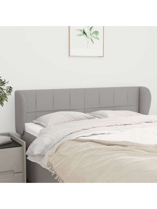 Čelo postele typu ušák světle šedé 147x23x78/88 cm textil