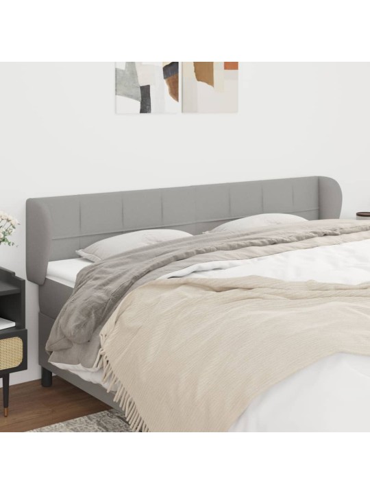 Čelo postele typu ušák světle šedé 203x23x78/88 cm textil