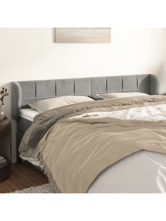 Čelo postele typu ušák světle šedé 163x23x78/88 cm samet
