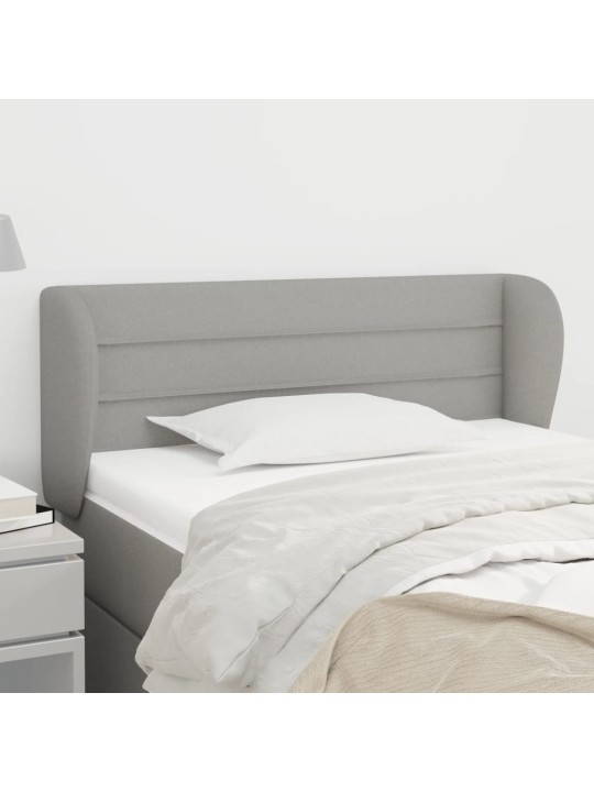 Čelo postele typu ušák světle šedé 103x23x78/88 cm textil