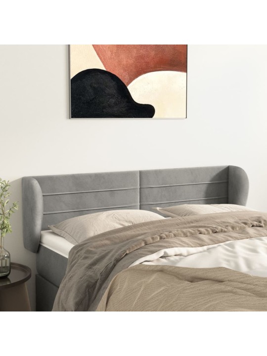 Čelo postele typu ušák světle šedé 147x23x78/88 cm samet