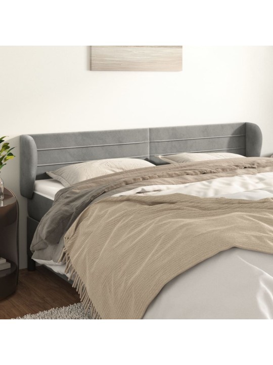 Čelo postele typu ušák světle šedé 163x23x78/88 cm samet