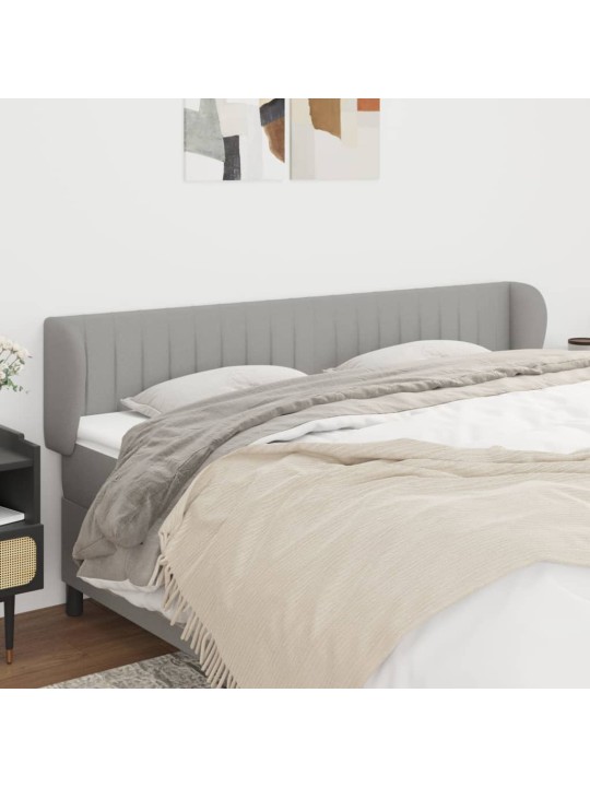 Čelo postele typu ušák světle šedé 203x23x78/88 cm textil