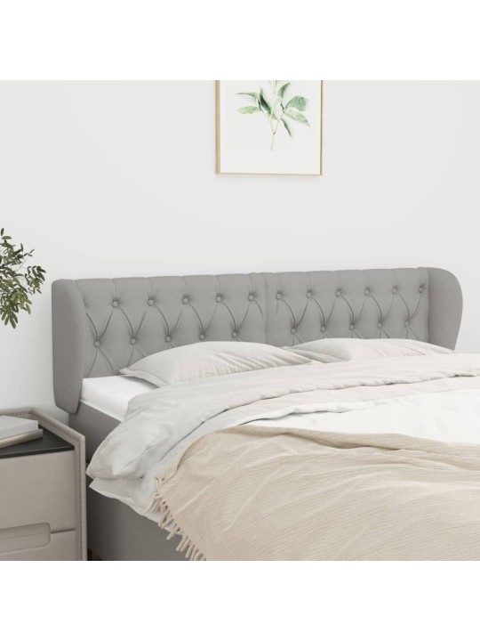 Čelo postele typu ušák světle šedé 147x23x78/88 cm textil