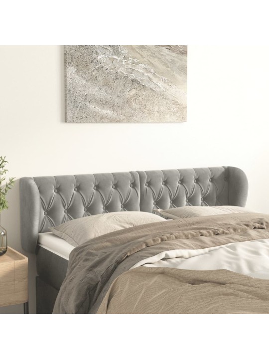 Čelo postele typu ušák světle šedé 163x23x78/88 cm samet