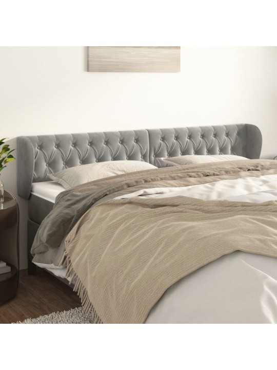 Čelo postele typu ušák světle šedé 183x23x78/88 cm samet