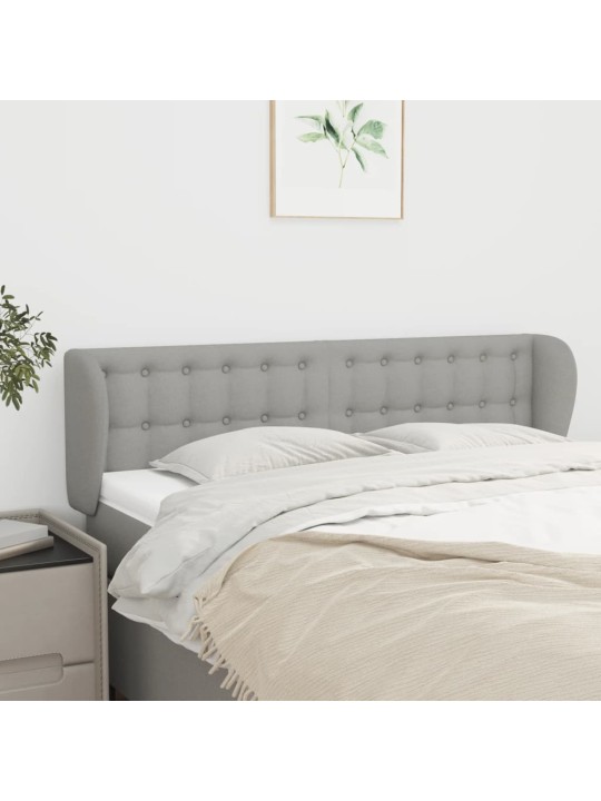 Čelo postele typu ušák světle šedé 147x23x78/88 cm textil