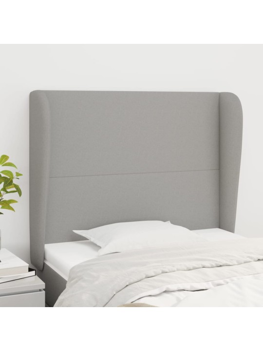 Čelo postele typu ušák světle šedé 83 x 23 x 118/128 cm textil