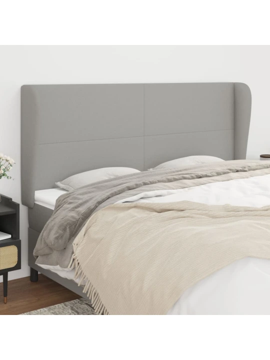 Čelo postele typu ušák světle šedé 163x23x118/128 cm textil