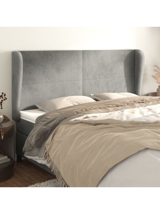 Čelo postele typu ušák světle šedé 163x23x118/128 cm samet