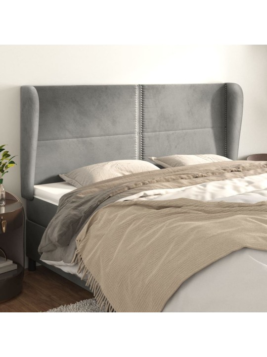 Čelo postele typu ušák světle šedé 183x23x118/128 cm samet