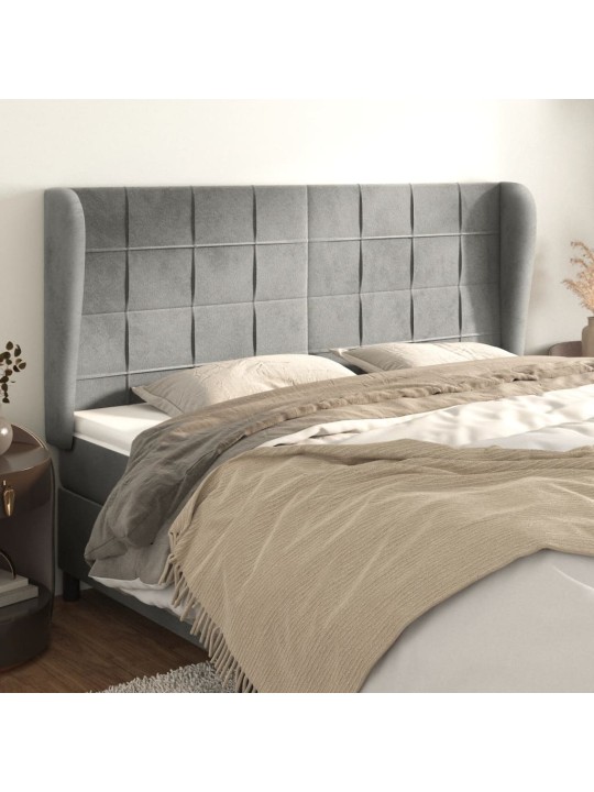 Čelo postele typu ušák světle šedé 163x23x118/128 cm samet