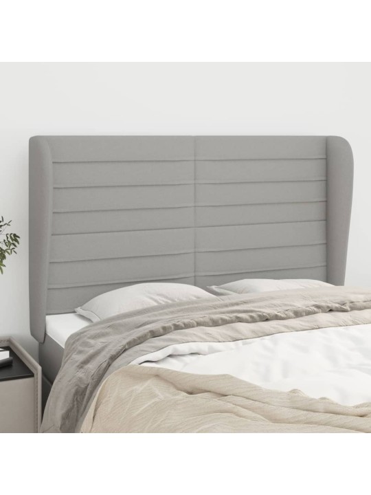 Čelo postele typu ušák světle šedé 147x23x118/128 cm textil