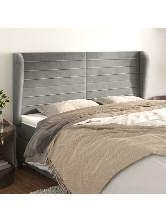 Čelo postele typu ušák světle šedé 163x23x118/128 cm samet