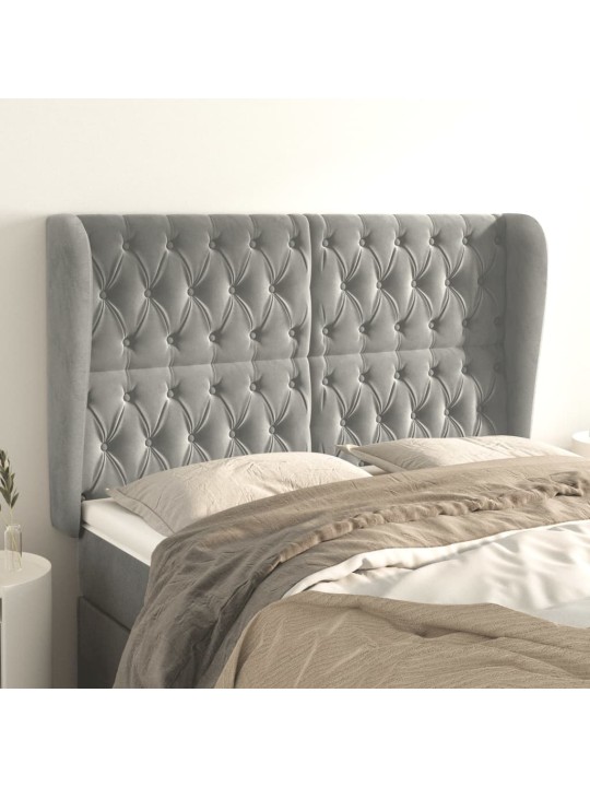 Čelo postele typu ušák světle šedé 163x23x118/128 cm samet