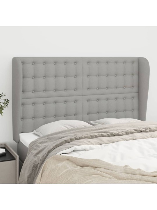 Čelo postele typu ušák světle šedé 147x23x118/128 cm textil