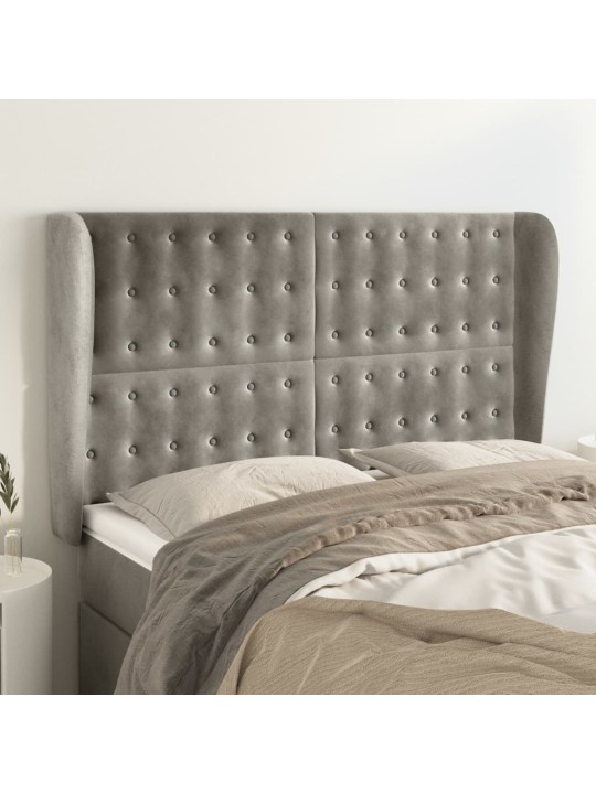 Čelo postele typu ušák světle šedé 147x23x118/128 cm samet