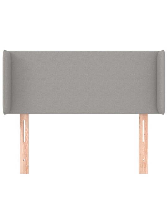 Čelo postele typu ušák světle šedé 83x16x78/88 cm textil
