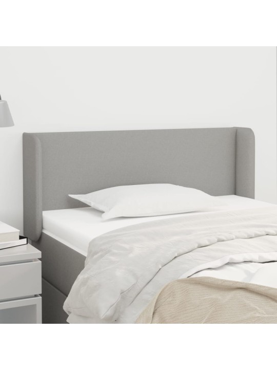 Čelo postele typu ušák světle šedé 83x16x78/88 cm textil