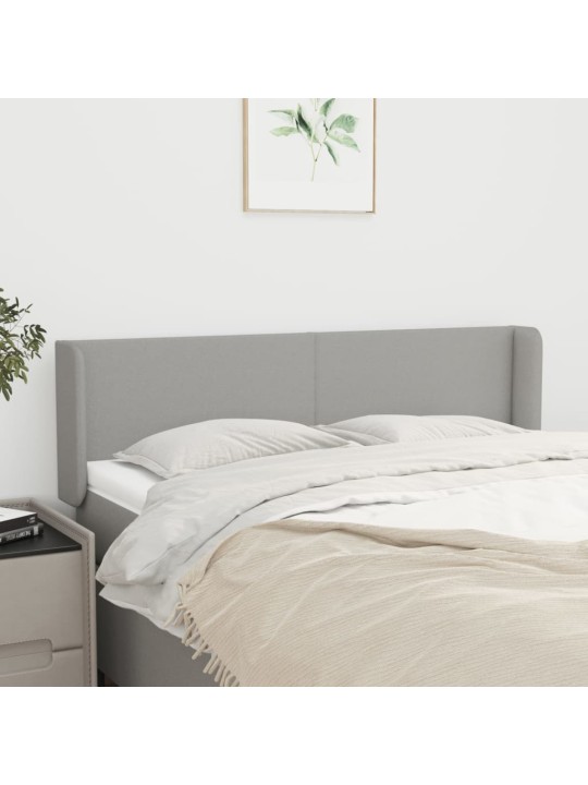 Čelo postele typu ušák světle šedé 147x16x78/88 cm textil