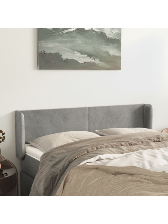 Čelo postele typu ušák světle šedé 147x16x78/88 cm samet
