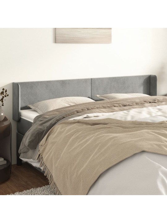Čelo postele typu ušák světle šedé 163x16x78/88 cm samet