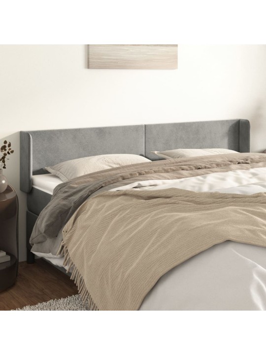 Čelo postele typu ušák světle šedé 203x16x78/88 cm samet