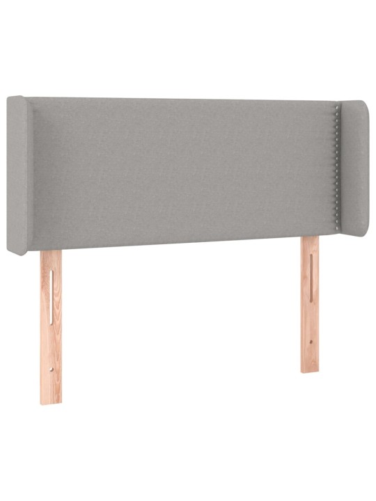 Čelo postele typu ušák světle šedé 83x16x78/88 cm textil