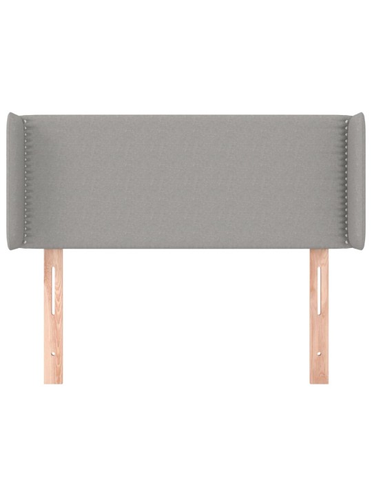 Čelo postele typu ušák světle šedé 83x16x78/88 cm textil