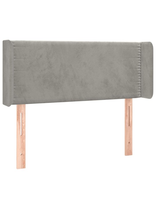 Čelo postele typu ušák světle šedé 83x16x78/88 cm samet