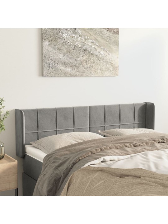 Čelo postele typu ušák světle šedé 147x16x78/88 cm samet