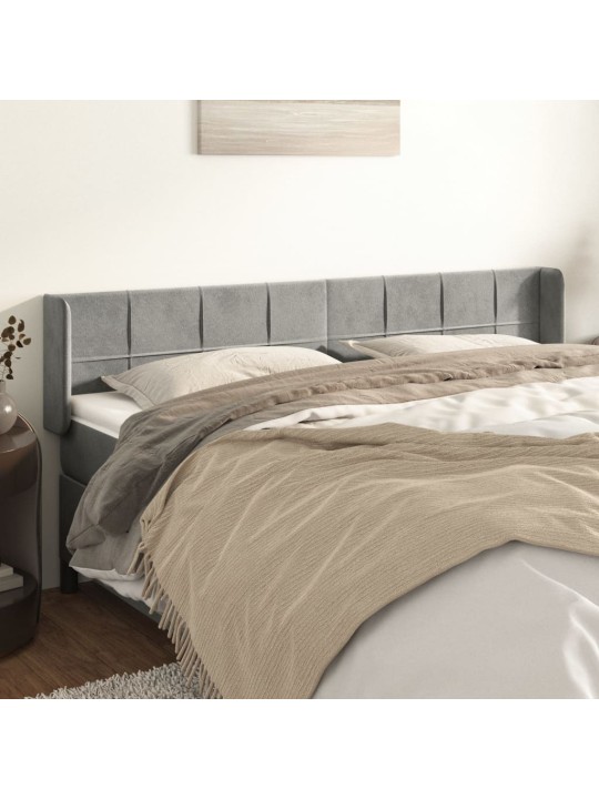 Čelo postele typu ušák světle šedé 203x16x78/88 cm samet