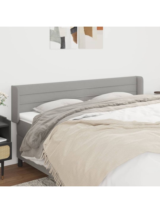Čelo postele typu ušák světle šedé 203x16x78/88 cm textil