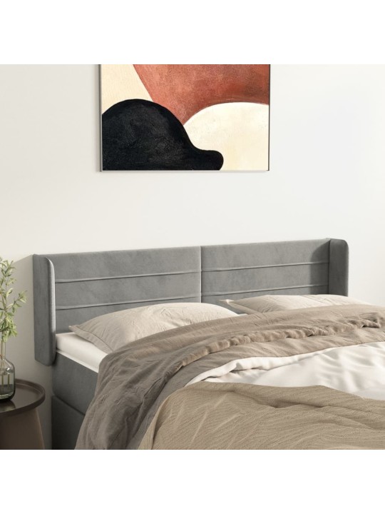 Čelo postele typu ušák světle šedé 147x16x78/88 cm samet