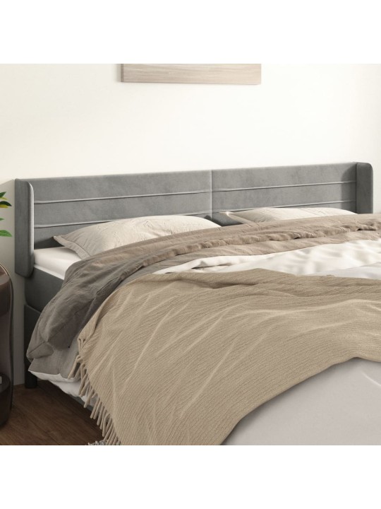 Čelo postele typu ušák světle šedé 203x16x78/88 cm samet