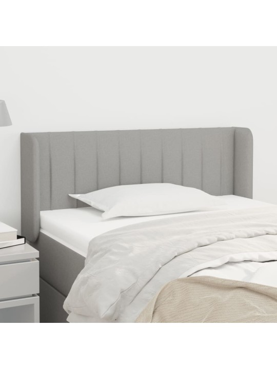 Čelo postele typu ušák světle šedé 103x16x78/88 cm textil