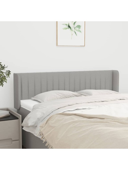 Čelo postele typu ušák světle šedé 147x16x78/88 cm textil