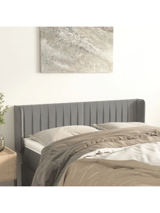 Čelo postele typu ušák světle šedé 147x16x78/88 cm samet
