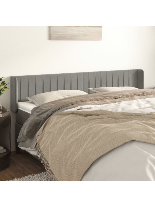 Čelo postele typu ušák světle šedé 203x16x78/88 cm samet