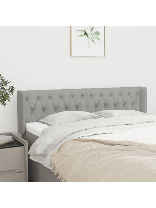 Čelo postele typu ušák světle šedé 147x16x78/88 cm textil