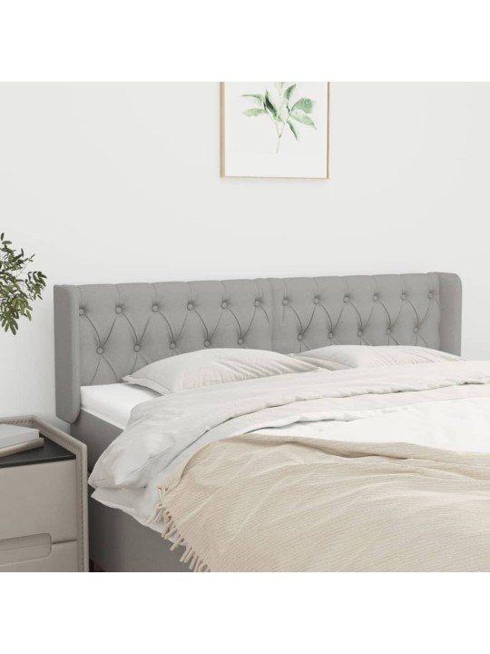 Čelo postele typu ušák světle šedé 163x16x78/88 cm textil