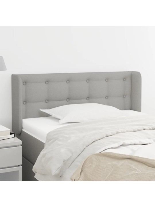 Čelo postele typu ušák světle šedé 103x16x78/88 cm textil