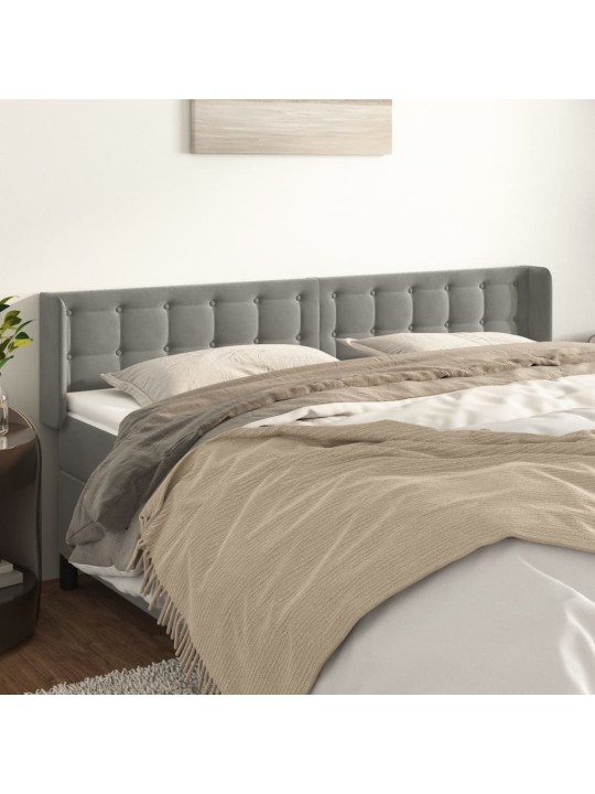 Čelo postele typu ušák světle šedé 163x16x78/88 cm samet