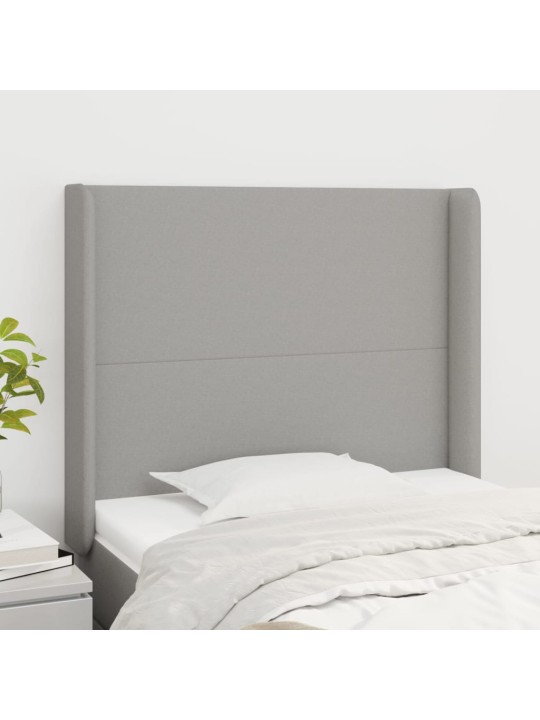 Čelo postele typu ušák světle šedé 83x16x118/128 cm textil